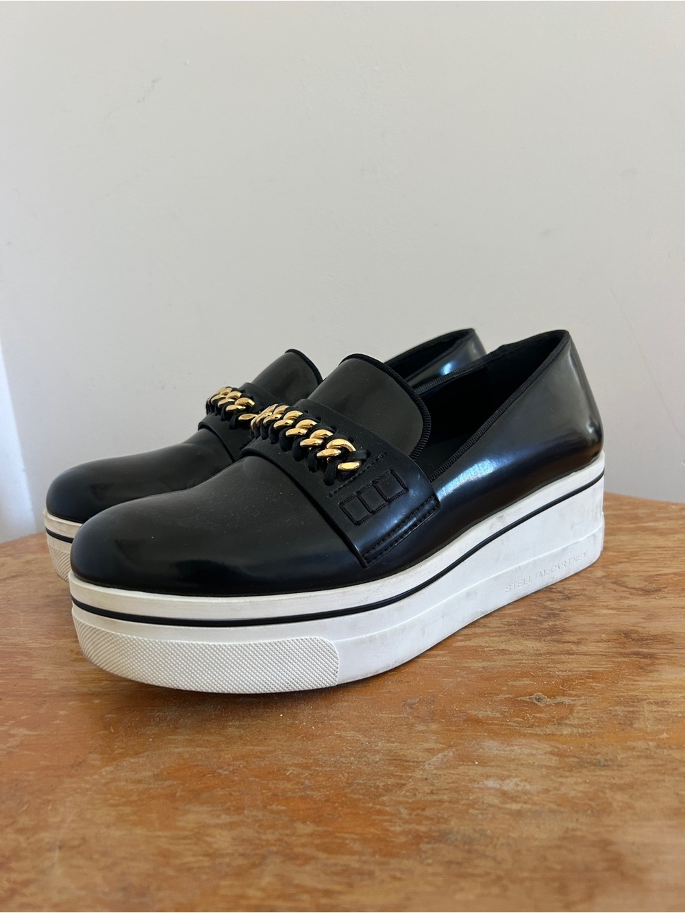 Stella McCartney Black Platform Slip-Ons with Gold Chain